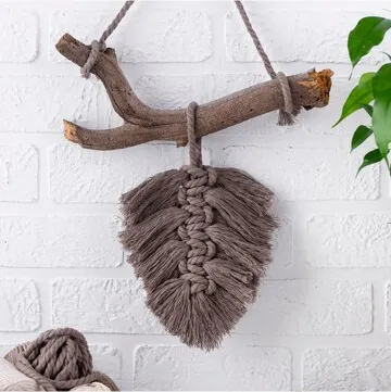Hand knitted brown wall hanging